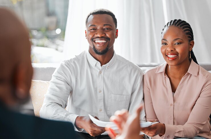 Insurance advisors meeting with a client